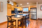 Large kitchen and stainless steel appliances, with a lot of moving around room to prep meals.